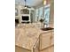 Kitchen island with granite counters, stainless sink, and white cabinets at 4901 Shoreline Cir, Sanford, FL 32771