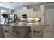 Bright and airy kitchen with white cabinetry, granite countertops, stainless steel appliances, and modern finishes at 4901 Shoreline Cir, Sanford, FL 32771