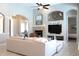 Inviting living room with stone fireplace and large television at 4901 Shoreline Cir, Sanford, FL 32771