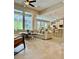 Open-concept living space with tile floors and view to pool at 4901 Shoreline Cir, Sanford, FL 32771