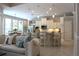 Open concept living space with island kitchen and view to pool at 4901 Shoreline Cir, Sanford, FL 32771