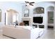 Comfortable living room featuring a stone fireplace, vaulted ceilings, and plenty of natural light, creating a relaxing atmosphere at 4901 Shoreline Cir, Sanford, FL 32771