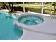 Close-up of a sparkling pool with an attached spa, perfect for relaxation and enjoying the outdoor living space at 4901 Shoreline Cir, Sanford, FL 32771