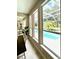 View of pool and screened patio from the breakfast nook at 4901 Shoreline Cir, Sanford, FL 32771