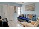Comfortable bedroom with a sleeper sofa, closet, and plenty of natural light at 5875 Talavera St, Orlando, FL 32807