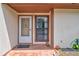 Charming front entrance with decorative details and tiled porch, giving curb appeal at 5875 Talavera St, Orlando, FL 32807
