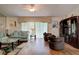 Inviting living room with comfortable seating, hardwood floors, and natural light at 5875 Talavera St, Orlando, FL 32807