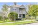 Two-story house with balcony, landscaping, and stone accents at 8650 Lovett Ave, Orlando, FL 32832