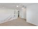 Upper hallway with white railing and carpet at 447 Winter Nellis Cir, Winter Garden, FL 34787