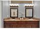 Double vanity bathroom with granite countertops and dark wood cabinets at 250 Shady Oaks Cir, Lake Mary, FL 32746