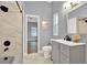 Modern bathroom with gray vanity and marble shower at 250 Shady Oaks Cir, Lake Mary, FL 32746