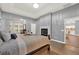 Main bedroom with fireplace, hardwood floors and access to the kitchen at 250 Shady Oaks Cir, Lake Mary, FL 32746