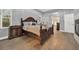 Main bedroom with hardwood floors and dark wood furniture at 250 Shady Oaks Cir, Lake Mary, FL 32746