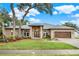 Beautiful single-story brick home featuring an attached garage and lush landscaping at 250 Shady Oaks Cir, Lake Mary, FL 32746