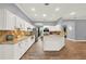 Bright kitchen featuring granite countertops, stainless steel appliances, and white cabinets at 250 Shady Oaks Cir, Lake Mary, FL 32746