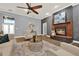 Cozy living room featuring a fireplace, comfortable seating, and hardwood floors at 250 Shady Oaks Cir, Lake Mary, FL 32746