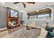 Living room with a fireplace, hardwood floors and a view into the sunroom at 250 Shady Oaks Cir, Lake Mary, FL 32746