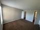 Spacious bedroom with neutral paint, carpeting and a large closet provides a comfortable living space at 4642 Commander Dr # 933, Orlando, FL 32822