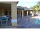 Inviting poolside area with shaded seating, offering a perfect spot to unwind and socialize at 4642 Commander Dr # 933, Orlando, FL 32822