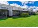 Townhomes with screened-in patios and a well-maintained lawn at 15223 Windmill Harbor Ct, Orlando, FL 32828