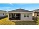 Enclosed patio with gray walls and a black frame at 3201 Songbird Cir, Harmony, FL 34773