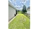 Grass backyard with privacy fence and side yard at 3201 Songbird Cir, Harmony, FL 34773