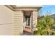 Inviting front entrance with stone columns and a modern door at 3201 Songbird Cir, Harmony, FL 34773