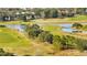 Expansive golf course with lush green fairways and lakes at 3201 Songbird Cir, Harmony, FL 34773