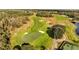 Aerial view of a lush green golf course at 3201 Songbird Cir, Harmony, FL 34773