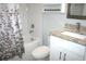 Clean bathroom featuring granite countertop and tub shower at 1148 Bancroft St, Deltona, FL 32725