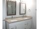 Double vanity bathroom with granite countertop and white cabinets at 1148 Bancroft St, Deltona, FL 32725