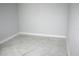 Empty bedroom with tile floors and neutral walls at 1148 Bancroft St, Deltona, FL 32725