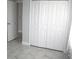 Bright bedroom with large closet and tile flooring at 1148 Bancroft St, Deltona, FL 32725