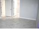 Bright bedroom with tile floors and access to bathroom and closet at 1148 Bancroft St, Deltona, FL 32725