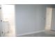 Bedroom with view of bathroom, showing tile floors and neutral walls at 1148 Bancroft St, Deltona, FL 32725