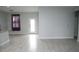 Spacious living room featuring tile floors and lots of natural light at 1148 Bancroft St, Deltona, FL 32725