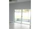 Bright living room with sliding doors leading to a screened patio at 1148 Bancroft St, Deltona, FL 32725