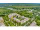 Beautiful aerial view of the condo community, with lush landscaping and lakeside views at 1401 Celebration Ave # 402, Celebration, FL 34747