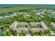 Overhead shot showcasing condo buildings with well-manicured green spaces and mature trees at 1401 Celebration Ave # 402, Celebration, FL 34747