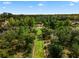 An aerial picture of a backyard walkway leading to a picturesque pergola at 1401 Celebration Ave # 402, Celebration, FL 34747