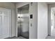 Interior view of an elevator in the condo building with doors and signage at 1401 Celebration Ave # 402, Celebration, FL 34747