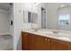 Double vanity bathroom with wood cabinets at 6533 Cartmel Ln, Windermere, FL 34786