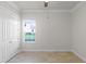 Empty bedroom with double doors and window at 6533 Cartmel Ln, Windermere, FL 34786