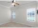 Bright bedroom with ceiling fan and large windows at 6533 Cartmel Ln, Windermere, FL 34786