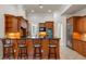 Kitchen with an island, granite countertops, and wooden cabinetry at 6533 Cartmel Ln, Windermere, FL 34786