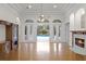 Bright living room with hardwood floors, fireplace, and French doors leading to the pool area at 6533 Cartmel Ln, Windermere, FL 34786