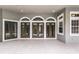 Spacious patio with French doors leading to the pool and backyard at 6533 Cartmel Ln, Windermere, FL 34786