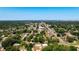 Aerial view of residential area with tree-lined streets, houses, and commercial buildings at 2812 Dawley Ave, Orlando, FL 32806