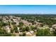 Aerial view of a neighborhood with lush greenery and city skyline in the distance at 2812 Dawley Ave, Orlando, FL 32806