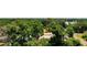 Aerial view of a tree-lined property with a view of the lake in the distance at 2812 Dawley Ave, Orlando, FL 32806